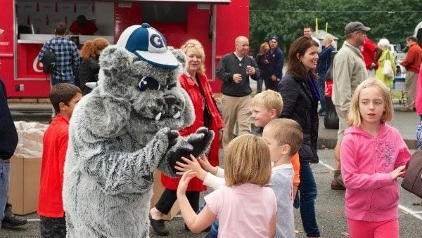 Jack the Bulldog Mascot talking to community children